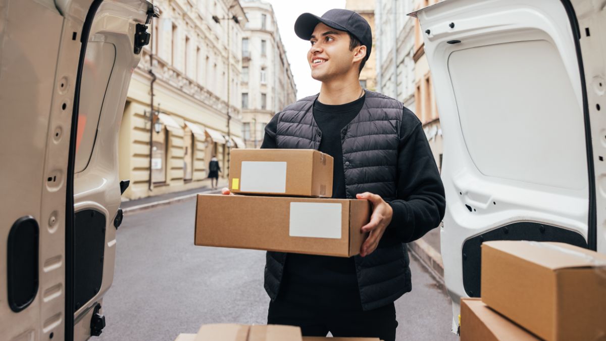 Movers NJ team loading boxes into a truck Jersey City moving company handling home relocation Professional movers NJ carrying furniture safely