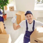 Movers and packers NJ packing household goods Jersey City movers carrying furniture safely Professional movers and packers loading a moving truck in NJ Affordable relocation service by Jersey City movers