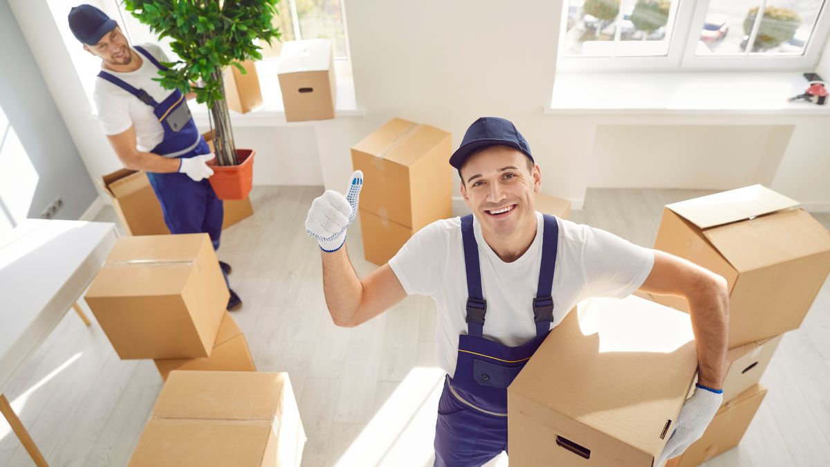 Movers and packers NJ packing household goods Jersey City movers carrying furniture safely Professional movers and packers loading a moving truck in NJ Affordable relocation service by Jersey City movers