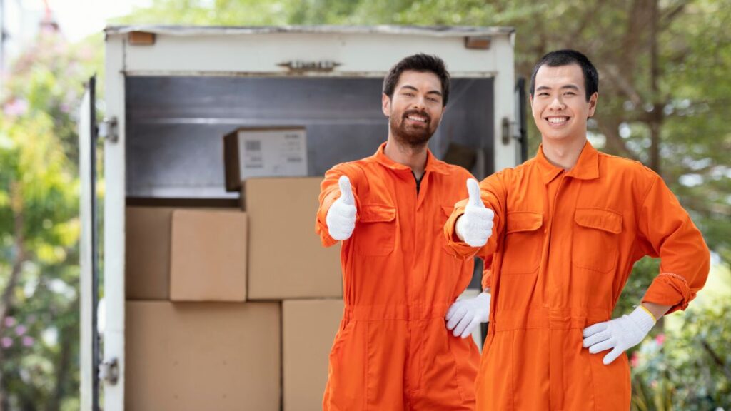 Top Jersey City moving company team from best moving companies in NJ transporting boxes”