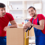Professional local movers in NJ from a top Jersey City moving team carrying furniture into a new home