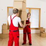 Jersey City movers packing fragile items into boxes