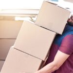 Best NJ movers setting up furniture inside new apartment
